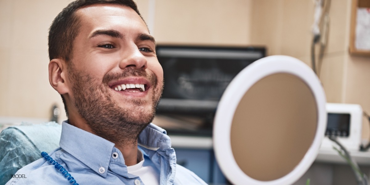 Middle aged man smiling after laser dentistry