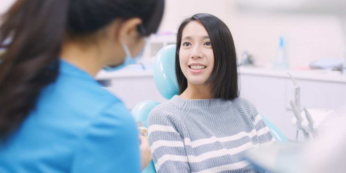 Female discussing treatment with dentist
