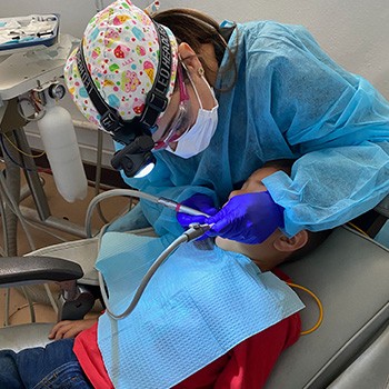 Photo of dentist working on a child patient